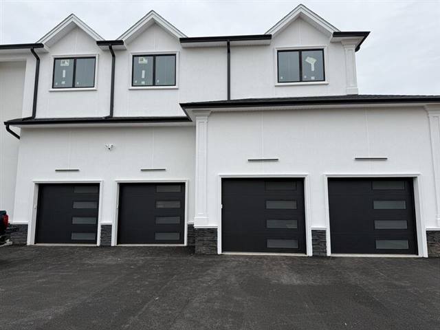 Modern black steel garage door installed in New Jersey